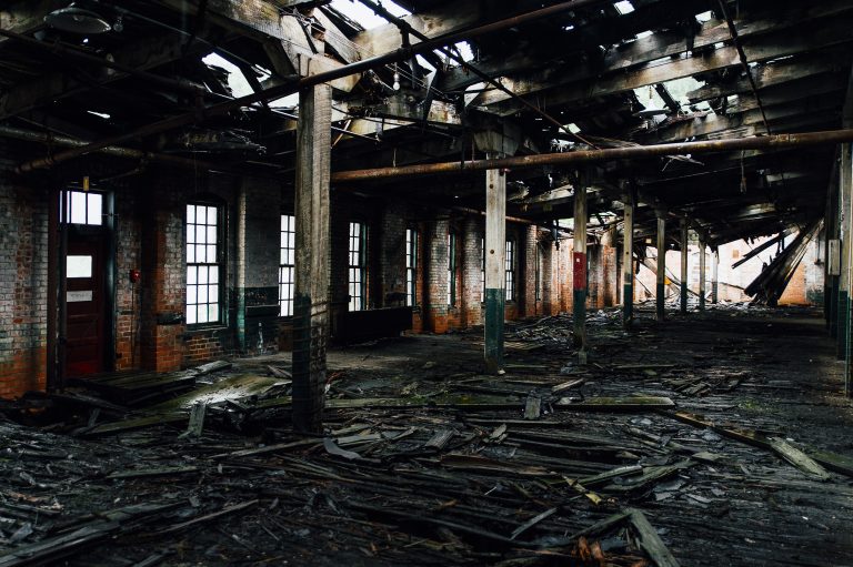 abandoned factor interior with wood debris