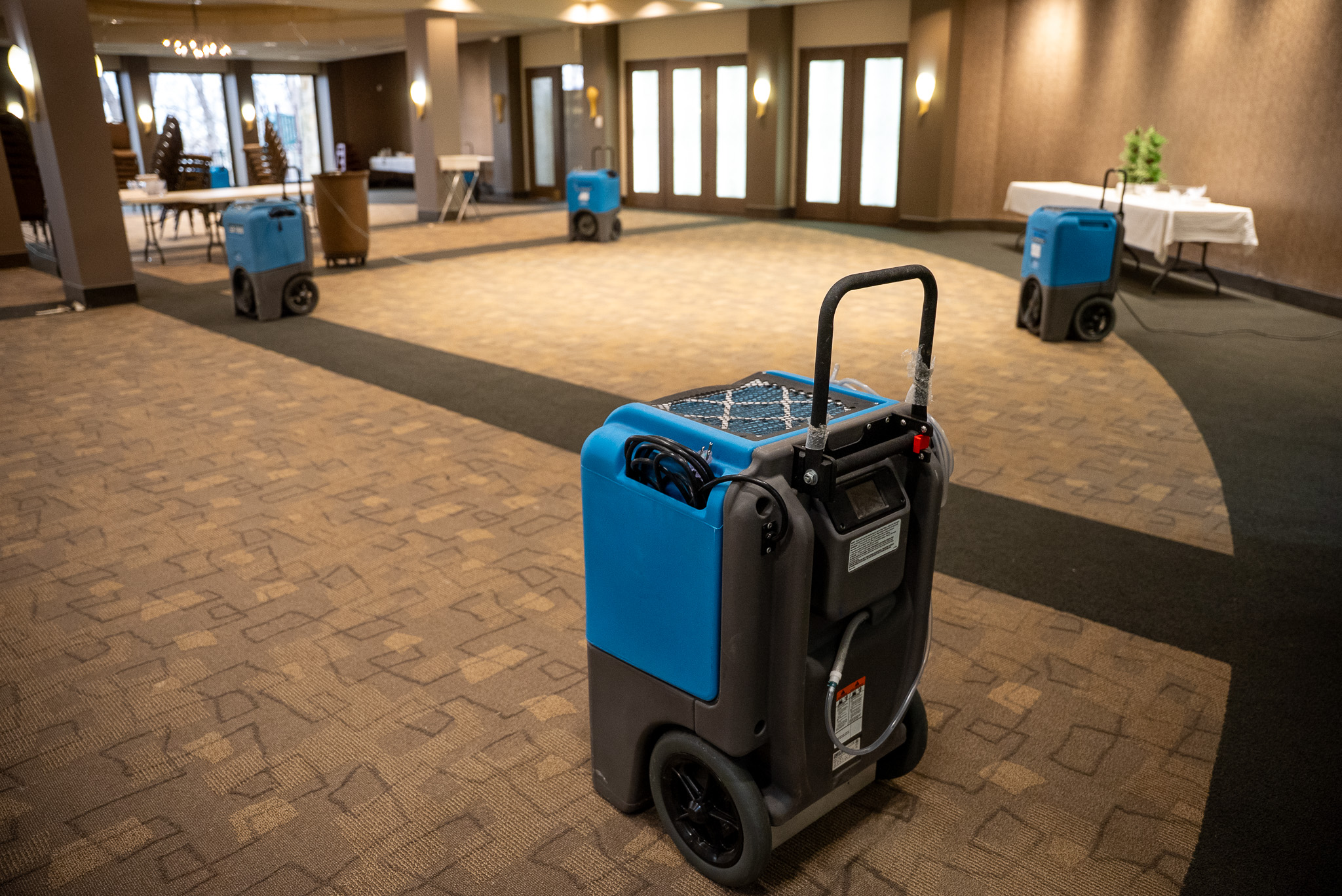 blue commercial drying fans in lobby