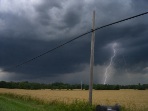 summer storm over a field with lightning